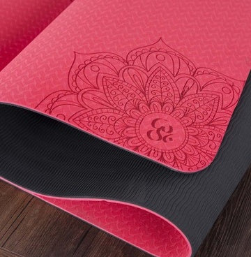 PEAK MOTION eco-friendly yoga mat in vibrant pink with intricate mandala design for comfortable workouts