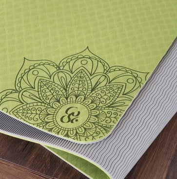 Eco-friendly yoga mat with intricate mandala design in vibrant green, perfect for practice and comfort